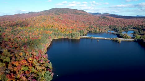 aerial view of new update new york lake in mountains with changing fall leaves