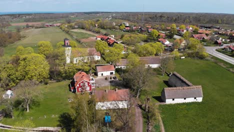 establishing shot of church and clergy house at oland island, sweden