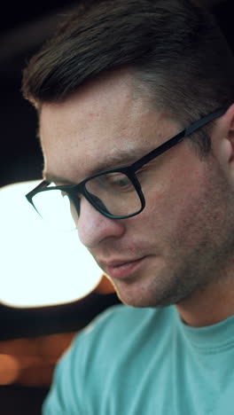 young handsome businessman in glasses. lifestyle professional man in casual cloth. vertical video