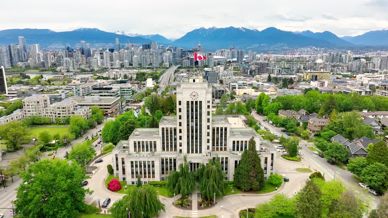 Premium stock video - Fly over vancouver city hall with canadian flag ...