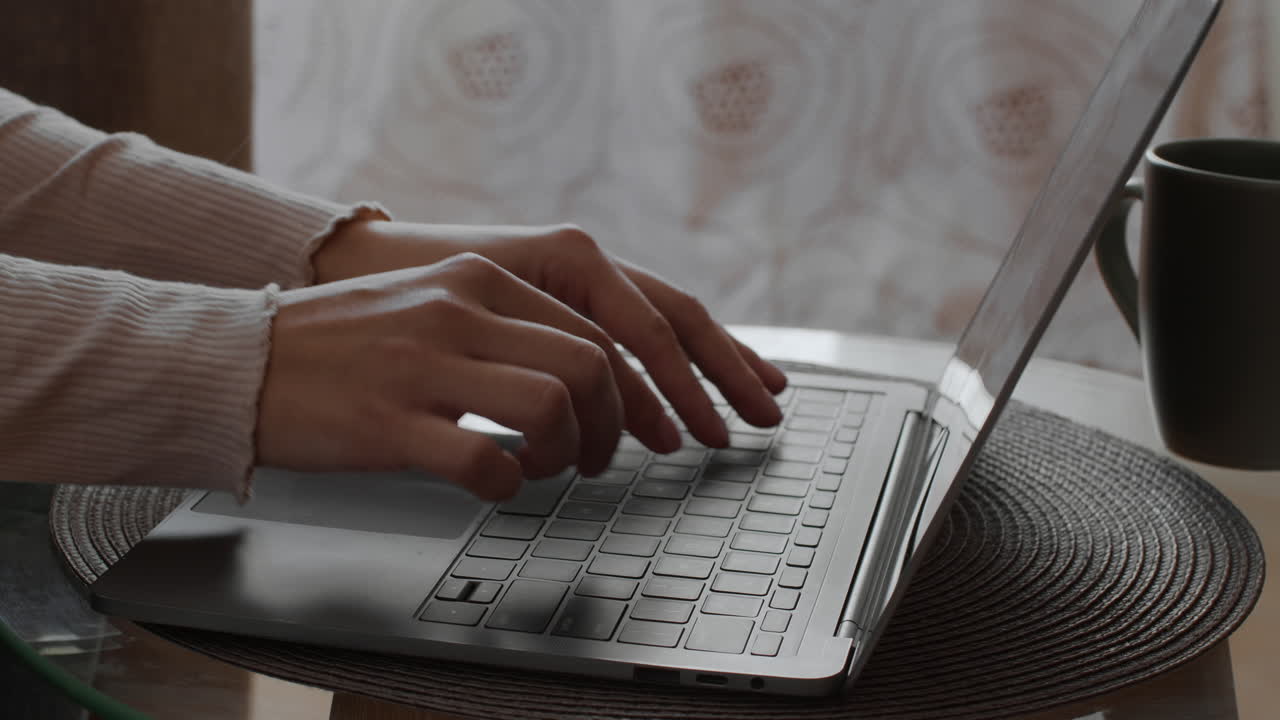 Woman working on a laptop at home