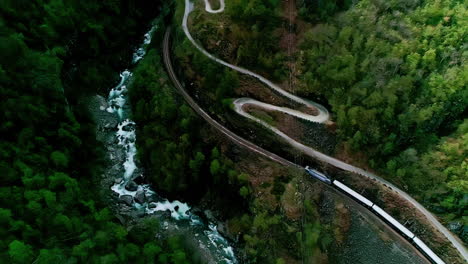 train ride through mountains landscape in auirland, norway, aerial view