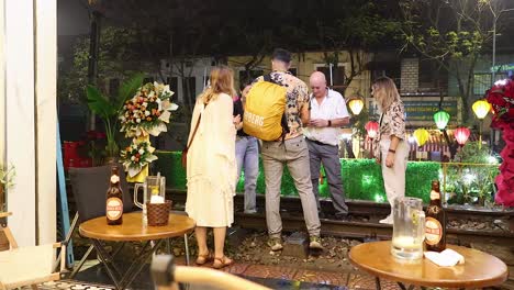 tourists chatting and enjoying a hanoi cafe