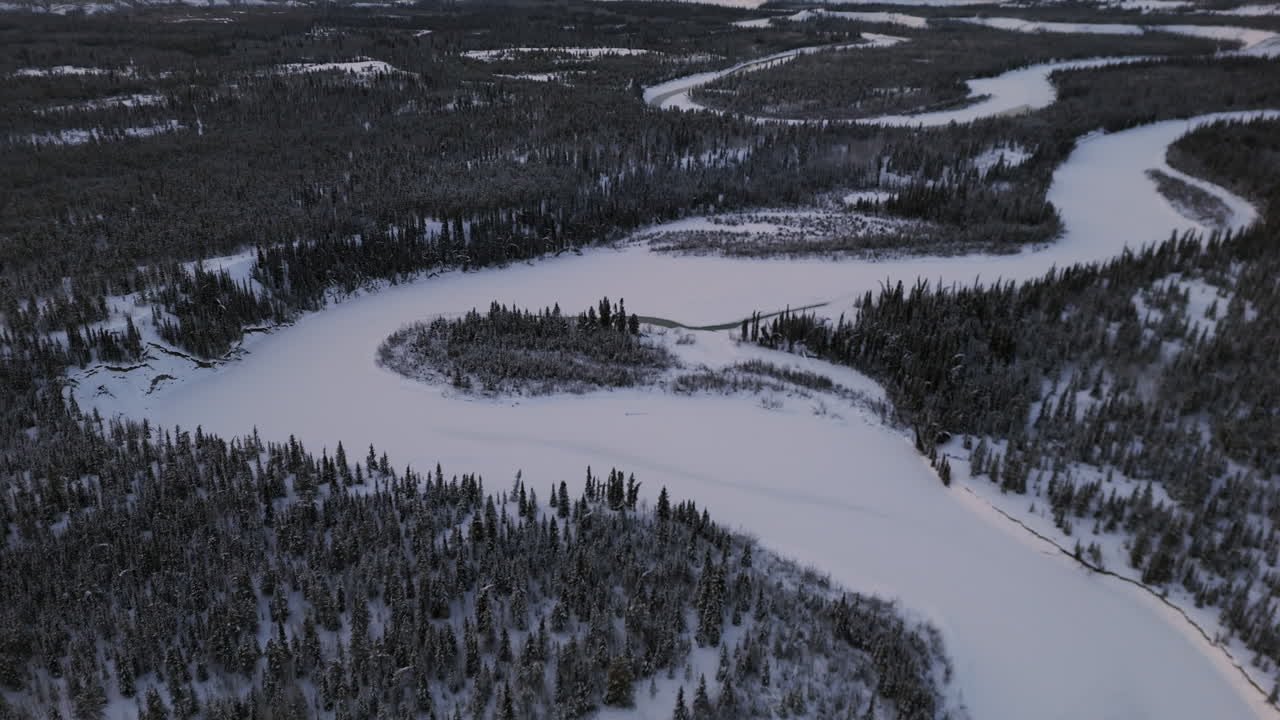 Frozen Takhini River During Winter In Ibex Valley, Yukon, Canada. - aerial shot