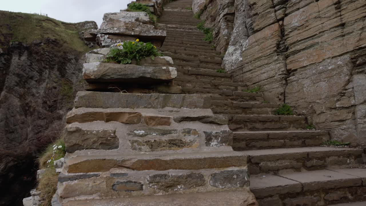 establishing the relentless stone steps at the Whaligoe Steps on the NC500 route
