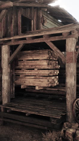 old wooden barn with stacked lumber