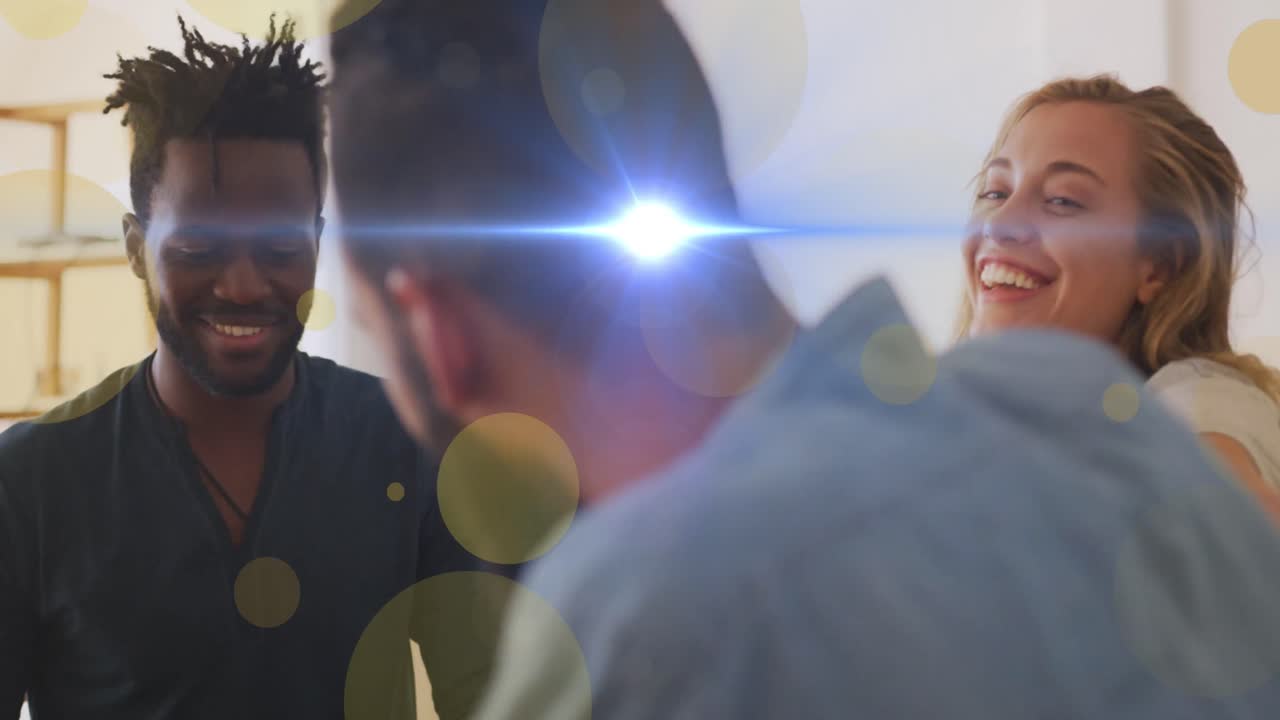 Animation of dots moving over happy diverse friends having fun at home