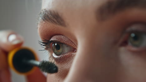applying mascara for makeup