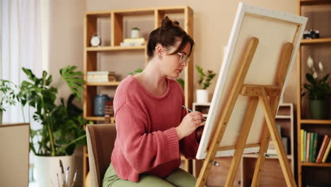 woman painting at home