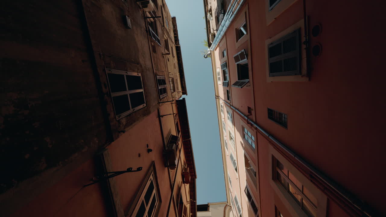 Looking up at Buildings in a Narrow Street