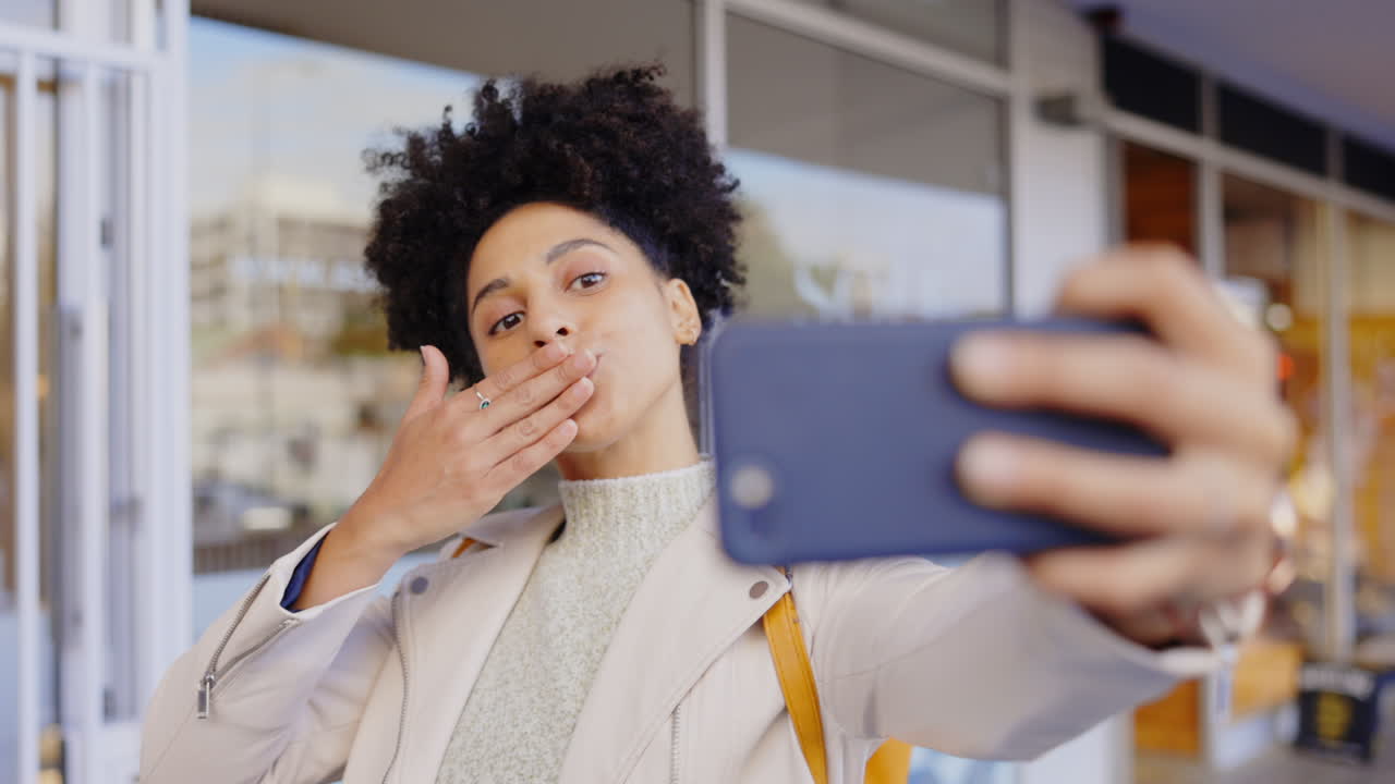 Woman, kiss selfie and afro in city with smile
