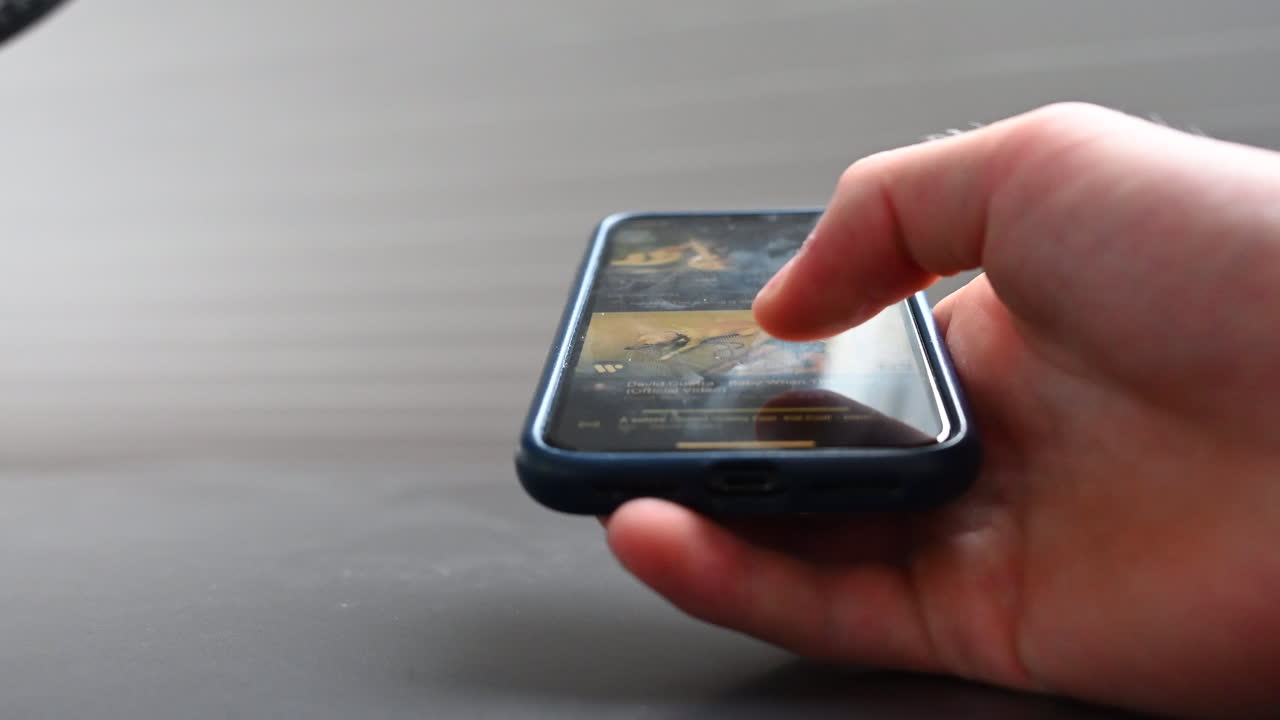 A phone user scrolls fast on a social media, being hit by the dopamine of surfing on the web