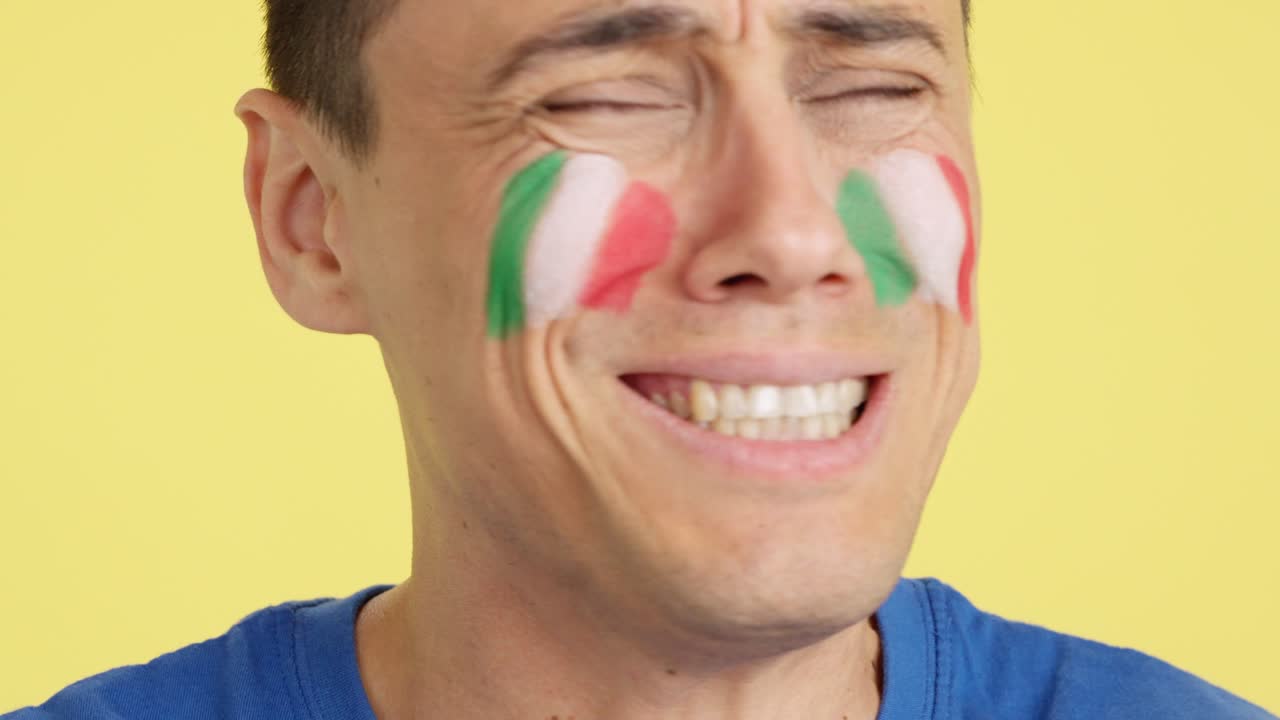 Very nervous man supporting italian team during a difficult match