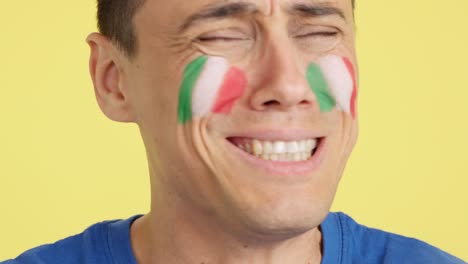 very nervous man supporting italian team during a difficult match