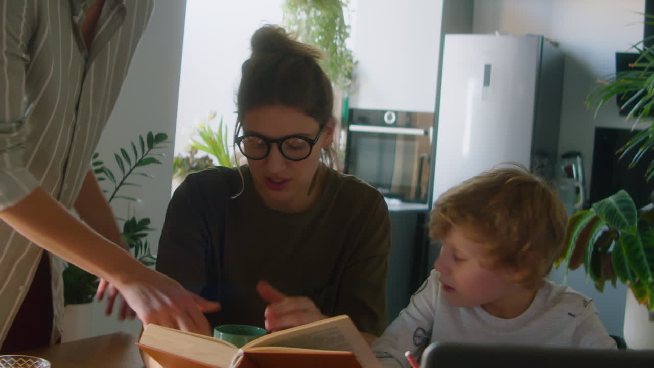Lesbian Mothers Helping Little Son with Homework