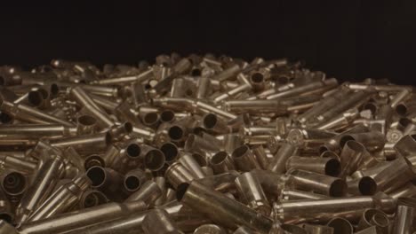 macro zoom out of fired ammunition casings