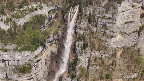 the seerenbachfälle waterfalls, one of the tallest in switzerland, viewed from above by a drone