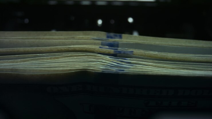 Automatic counting machine counting dollar banknotes. Money counting machine