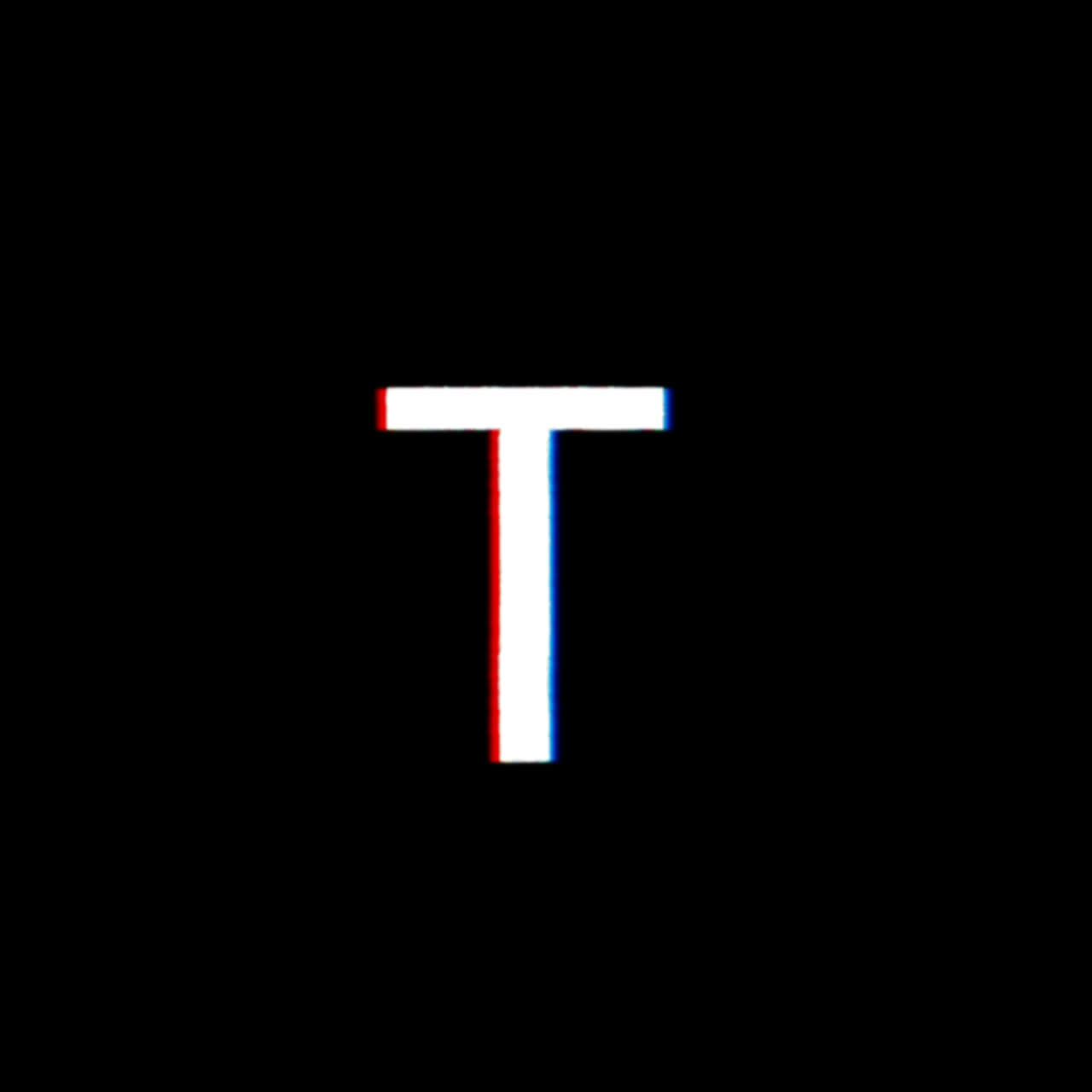 Bogstavet T med glitch-forvrængningseffekt på sort baggrund.
