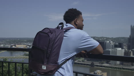 orbiting shot of african american tourist enjoying a city view stabilized shot in 4k uhd