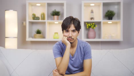 Man-looking-depressed-at-camera.