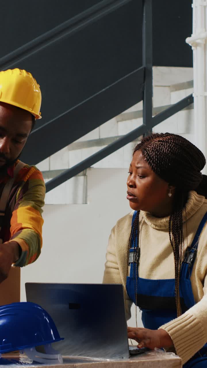 Vertical video: Group of trained workers using depot equipment