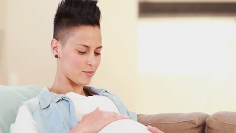 Pregnant-woman-lying-on-the-couch