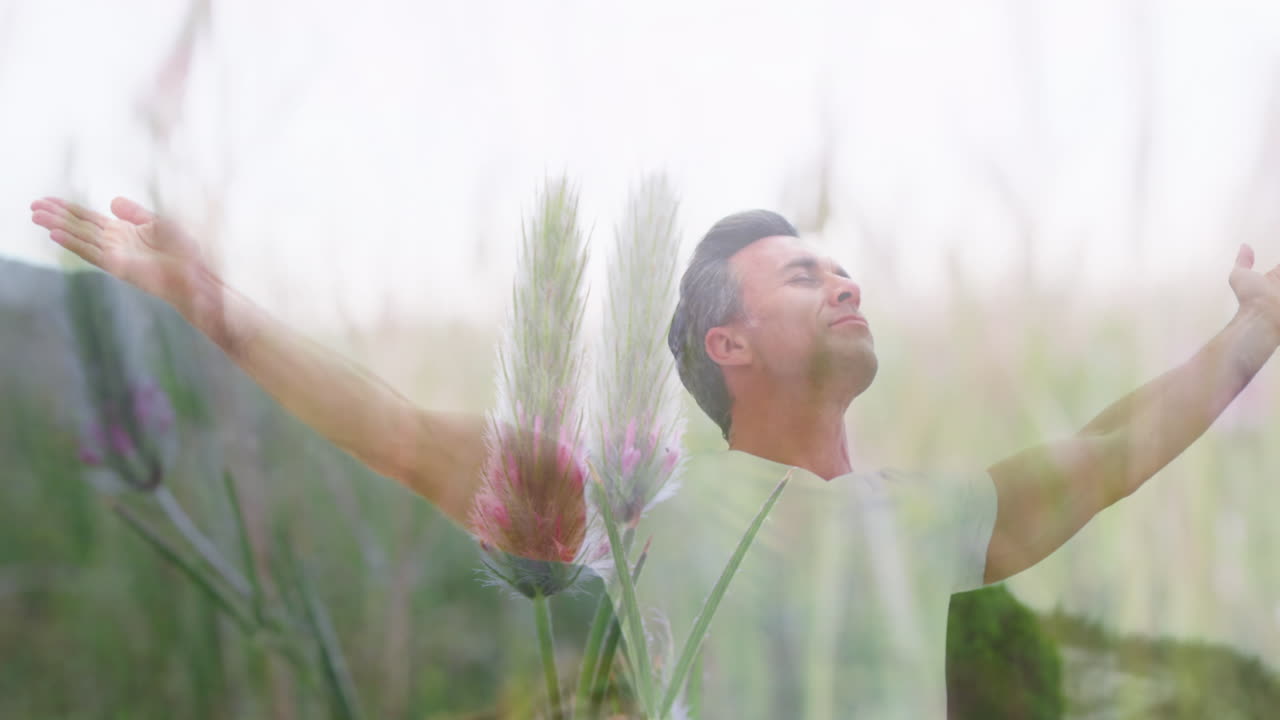 백인 남자의 애니메이션으로 팔이 풍경 위에 펴져 있습니다.