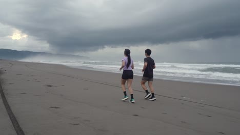 couple running on a beach
