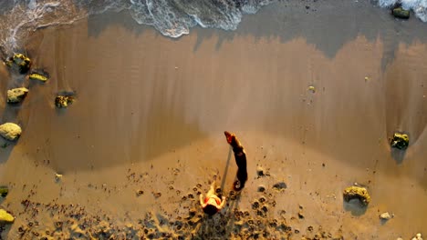 lady walking to the waves with her dog at sunset -lebanon -top view