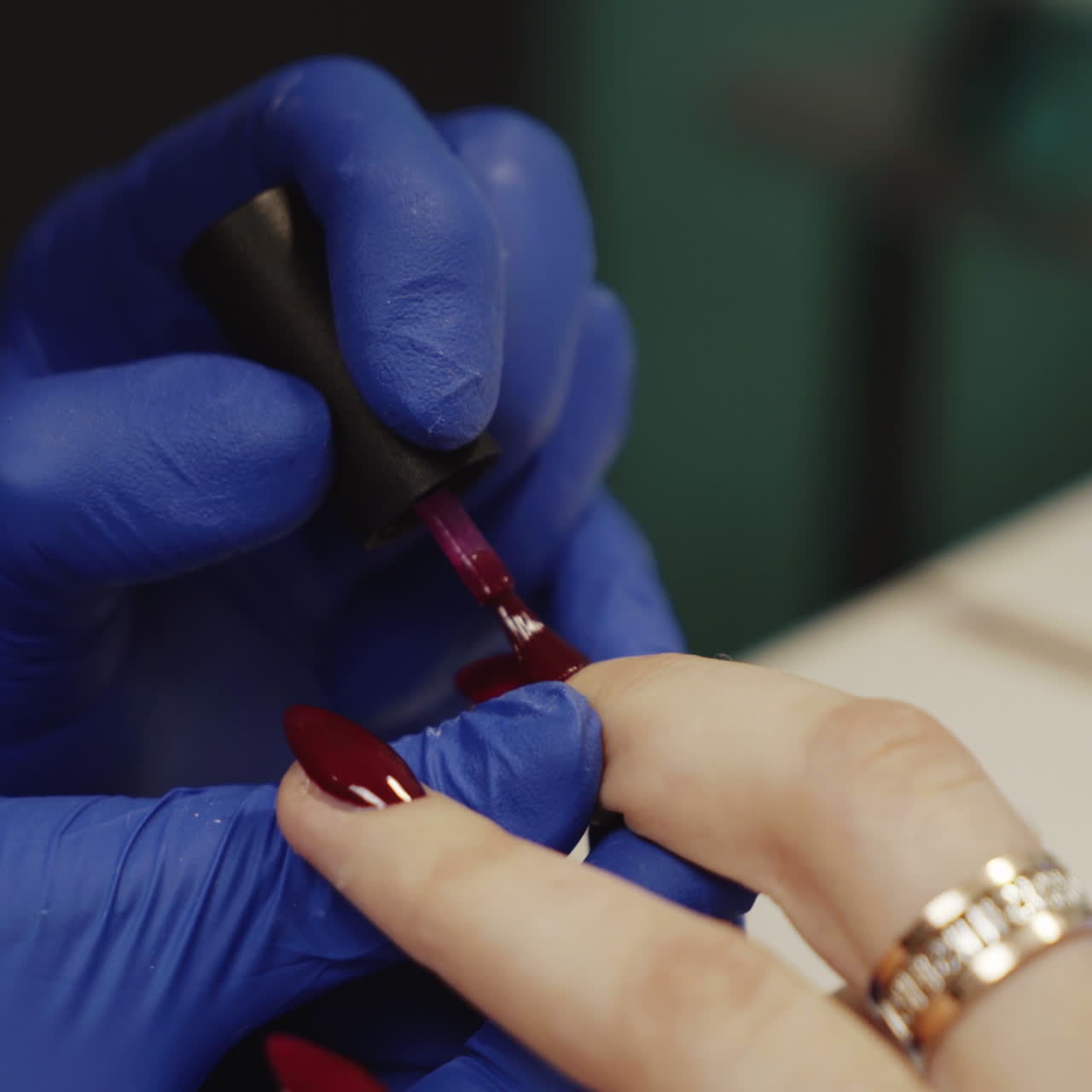 Woman getting her nails painted