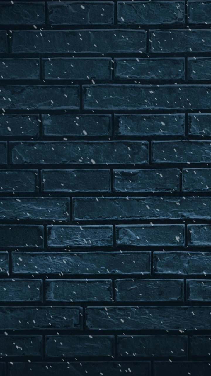 Animazione di paesaggio invernale con neve che cade su muro di mattoni