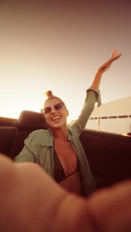 woman enjoying a convertible ride