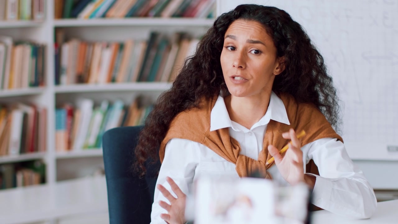 Young Woman Recording Educational Video Content in Library