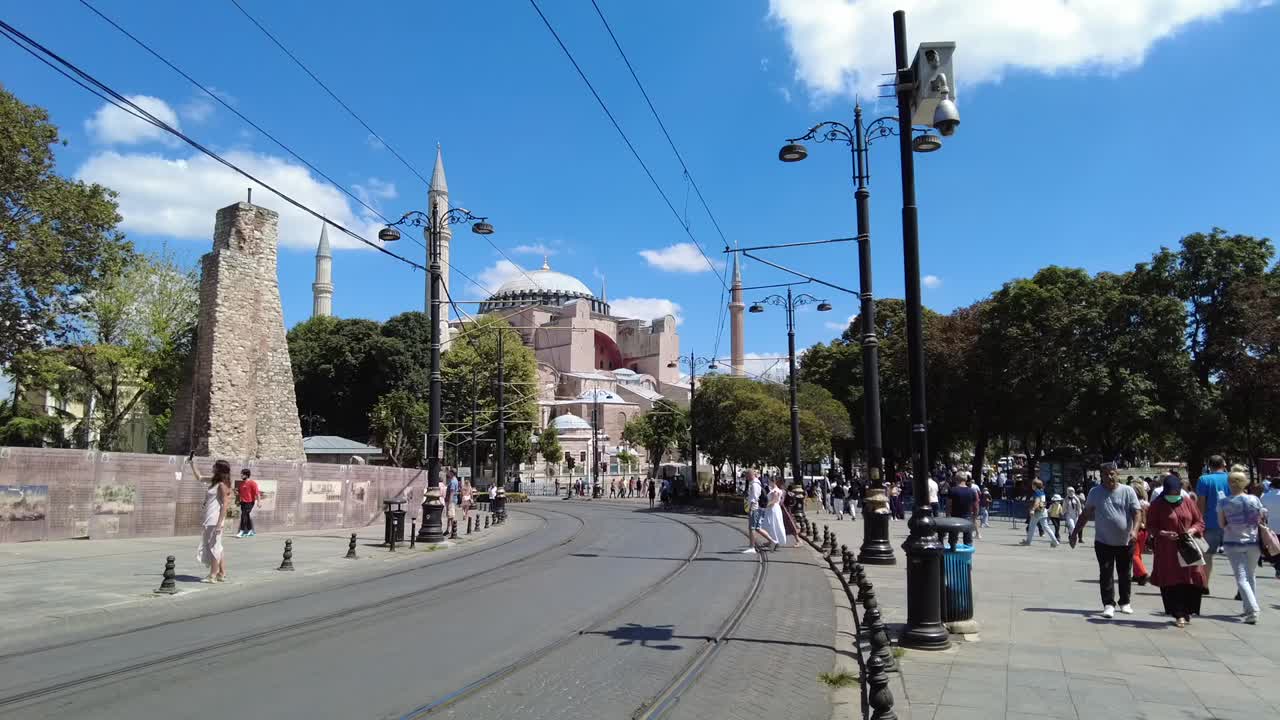 Park and pedestrian walkway in front of Hagia Sophia, Istanbul, Turkey. Once an Orthodox basilica, later a mosque, and now a museum, the area blends serene greenery with historic significance.