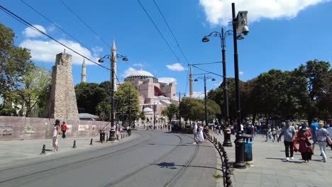 park and pedestrian walkway in front of hagia sophia, istanbul, turkey. once an orthodox basilica, later a mosque, and now a museum, the area blends serene greenery with historic significance.