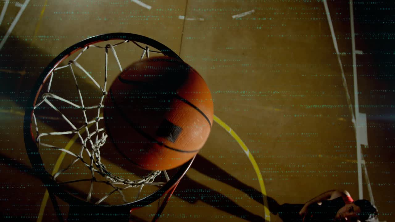 Player entering left, jumping, putting ball through rim to score, teal dots showing path for sports