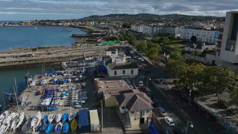 royal st. george yacht club, dún laoghaire, county dublin, ireland, september 2024. drone slowly orbits counter clockwise with the east pier and sandycove in the background.