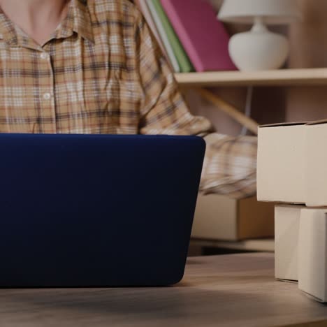 a small business owner prepares the goods for delivery to customers