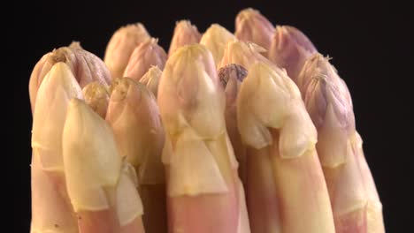 portion of fresh white asparagus on turn table