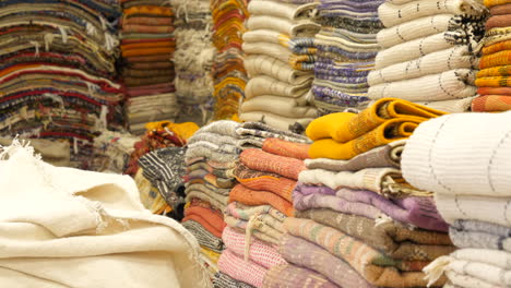 heaps of traditional moroccan carpets for sale at marrakesh marketplace