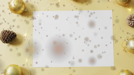 animation of spots of light over white paper with copy space and christmas decorations