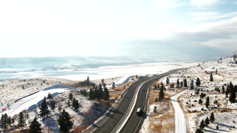 Astonishing-Shot-of-the-Coquihalla-Highway-5a-on-a-foggy-day-surrounded-by-Trees,Grassland-mountains-of-the-Nicola-Valley-in-winter,-snow-covered-landscape-with-sunshine-close-to-Merritt,-BC