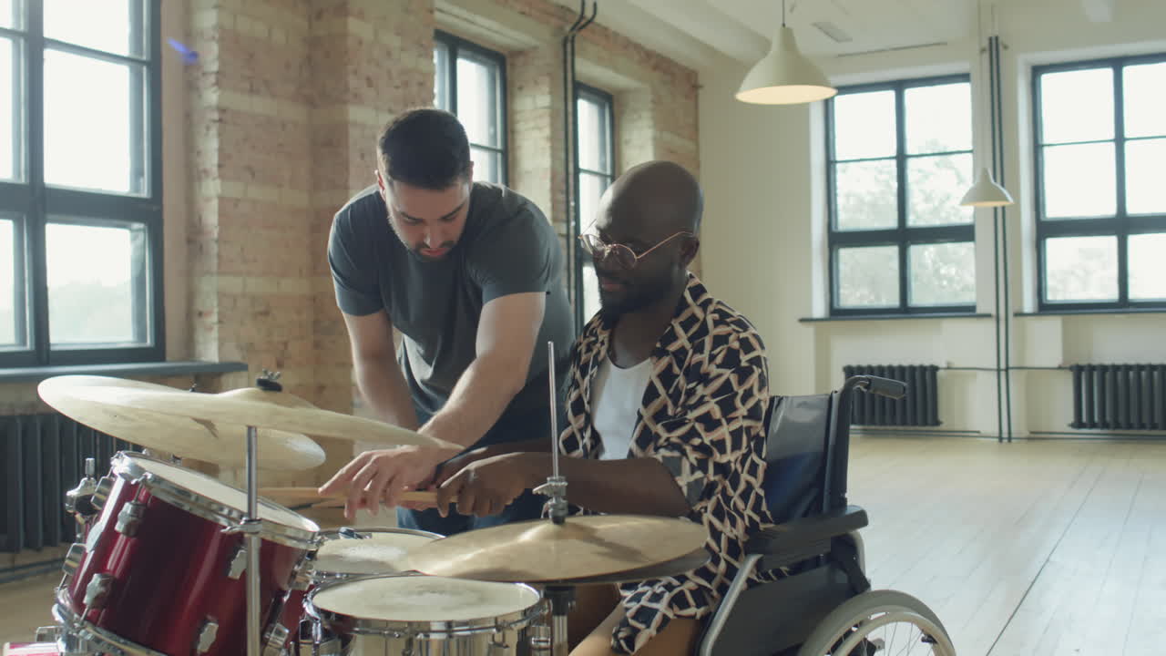 Black Man Learning Drums with Caucasian Music Teacher