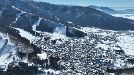 Aerial-establishing-shot-of-Japans-Nozawaonsen-Mountain-Ski-Resort-Village