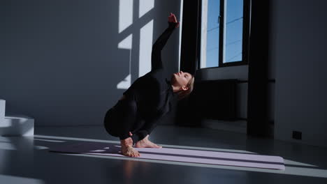 woman doing yoga in studio