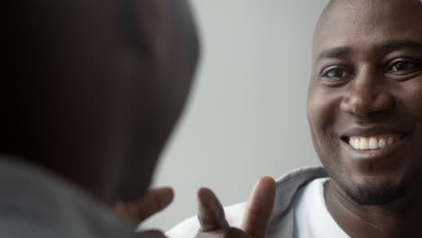 man looking at himself in a mirror