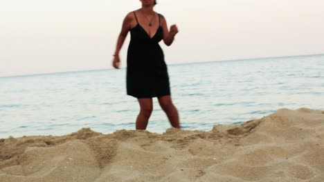 woman dancing salsa on the beach