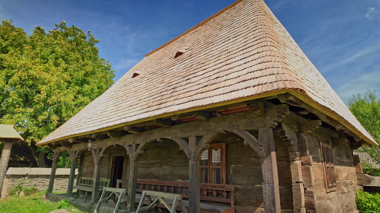Traditional Romanian rustic Wooden House Architecture with shingle roof