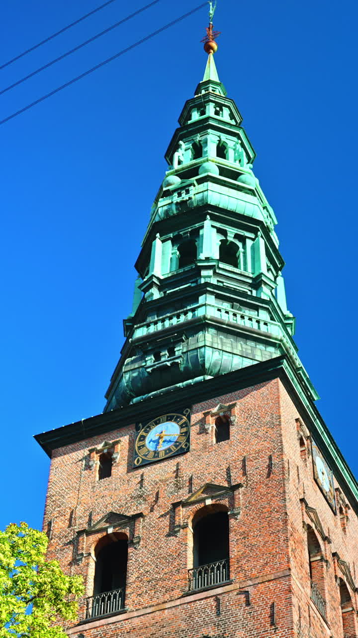 The Nikolaj Art Gallery in the former St. Nicholas Church on Nikolaj Plads in Copenhagen, Denmark. Vertical